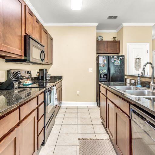 24 South Sand Palm Road, Unit 48 Freeport, FL 32439 - Photo 10 of 27 a kitchen with stainless steel appliances granite countertop a sink and cabinets