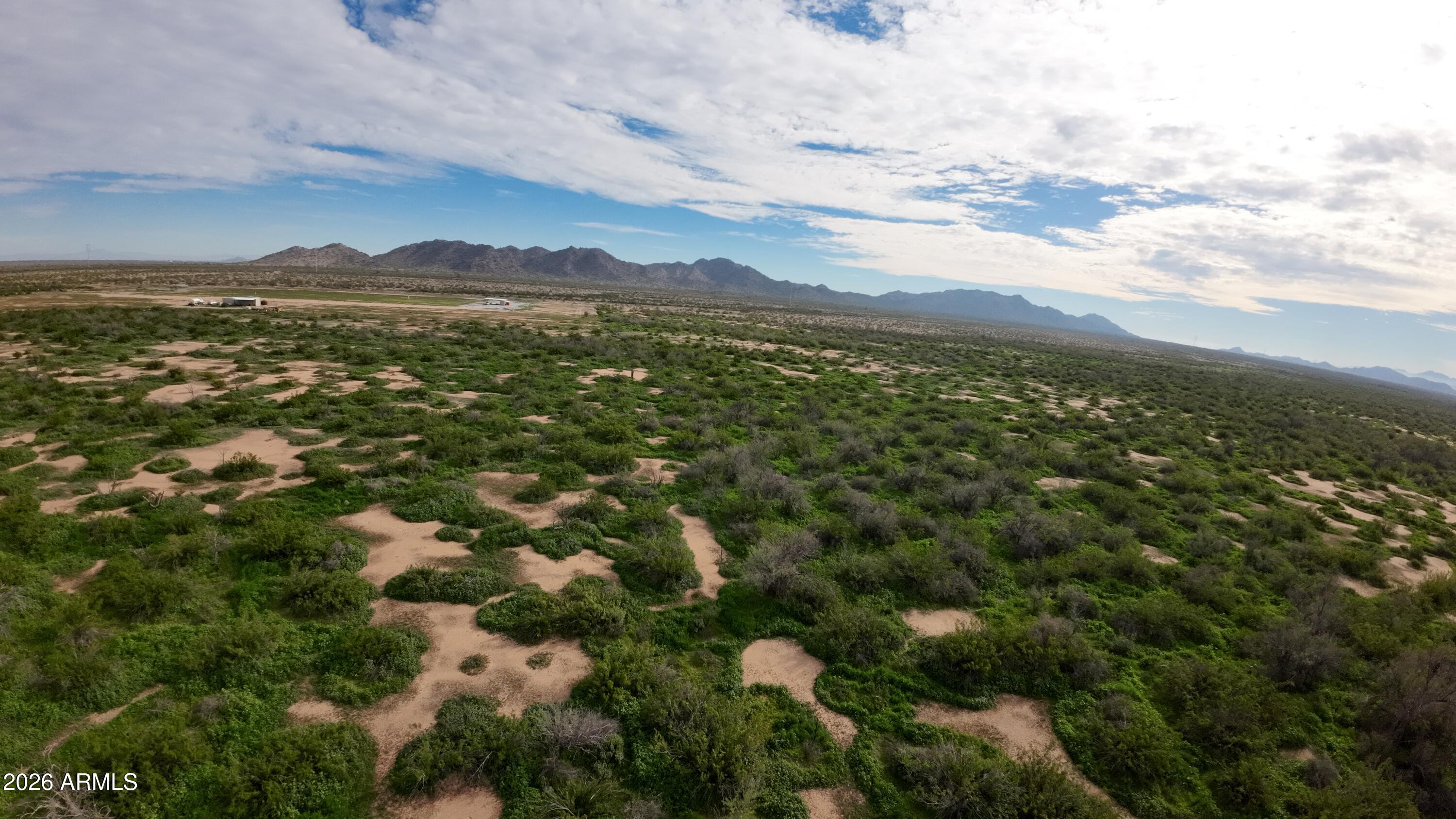 0 South Undetermined Road Maricopa, AZ 85139 - Photo 4 of 12 a view of a city with mountains in the background