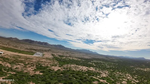 a view of mountain with sky