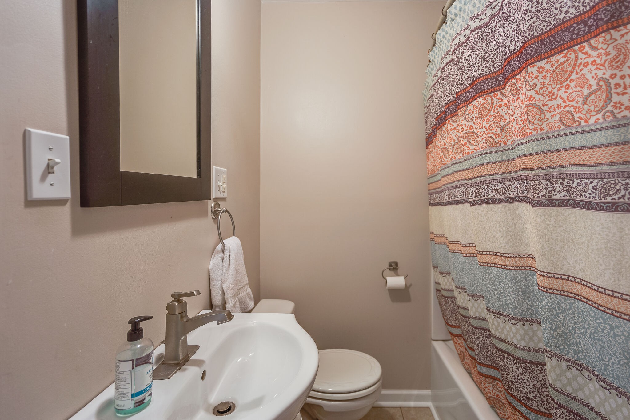 2241 Battle Creek Road Springfield, TN 37172 - Photo 11 of 32 a bathroom with a sink a toilet and shower curtain