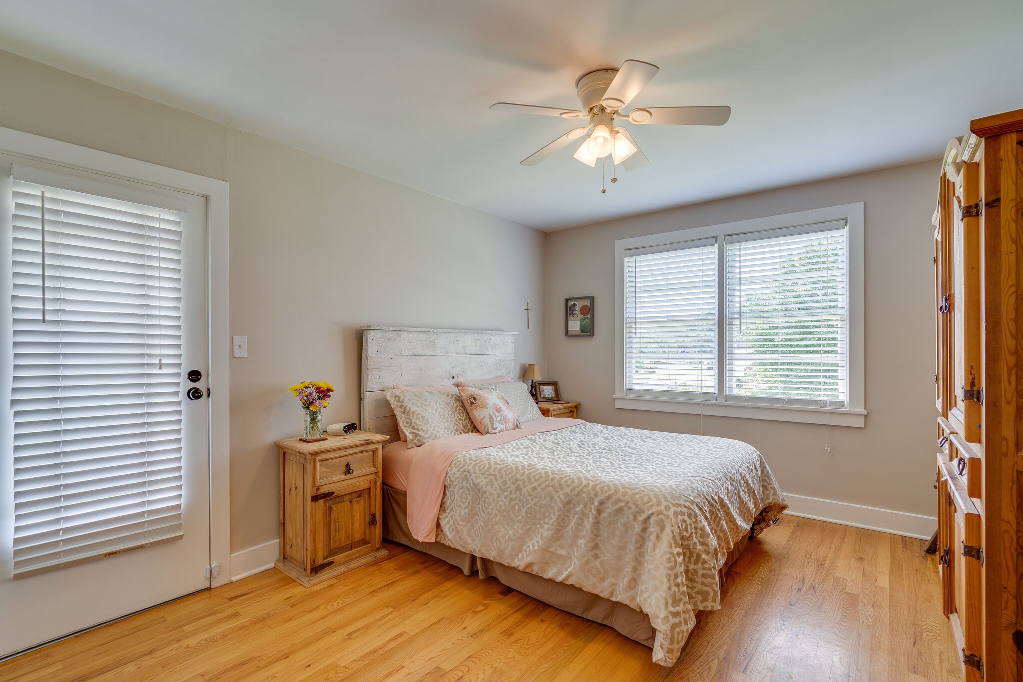 2241 Battle Creek Road Springfield, TN 37172 - Photo 13 of 32 a bedroom with a bed and a chandelier