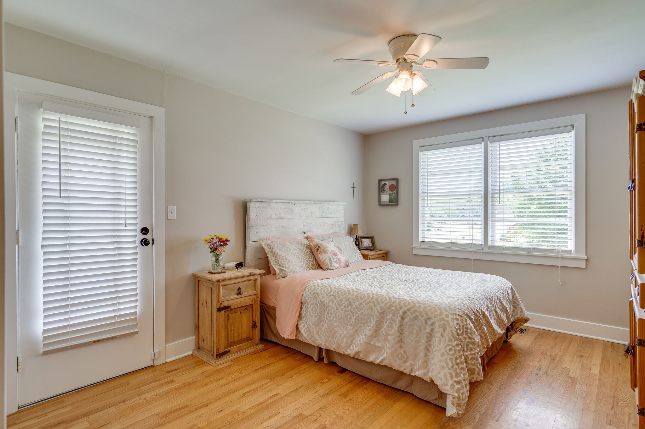 2241 Battle Creek Road Springfield, TN 37172 - Photo 14 of 32 a bedroom with a bed and a chandelier