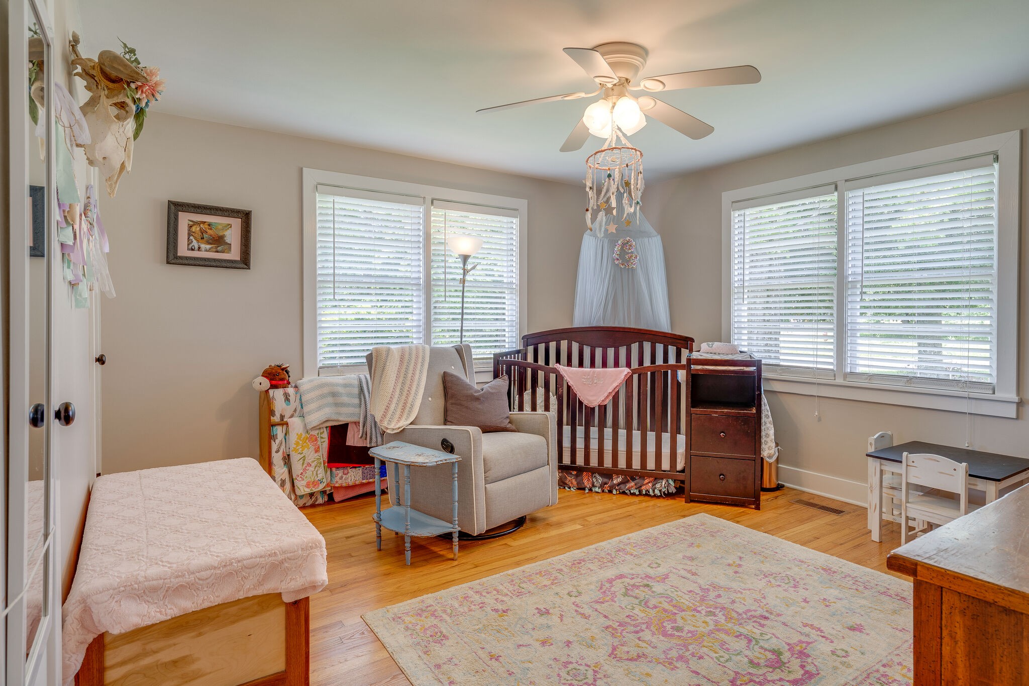 2241 Battle Creek Road Springfield, TN 37172 - Photo 20 of 32 a bedroom with furniture and a chandelier