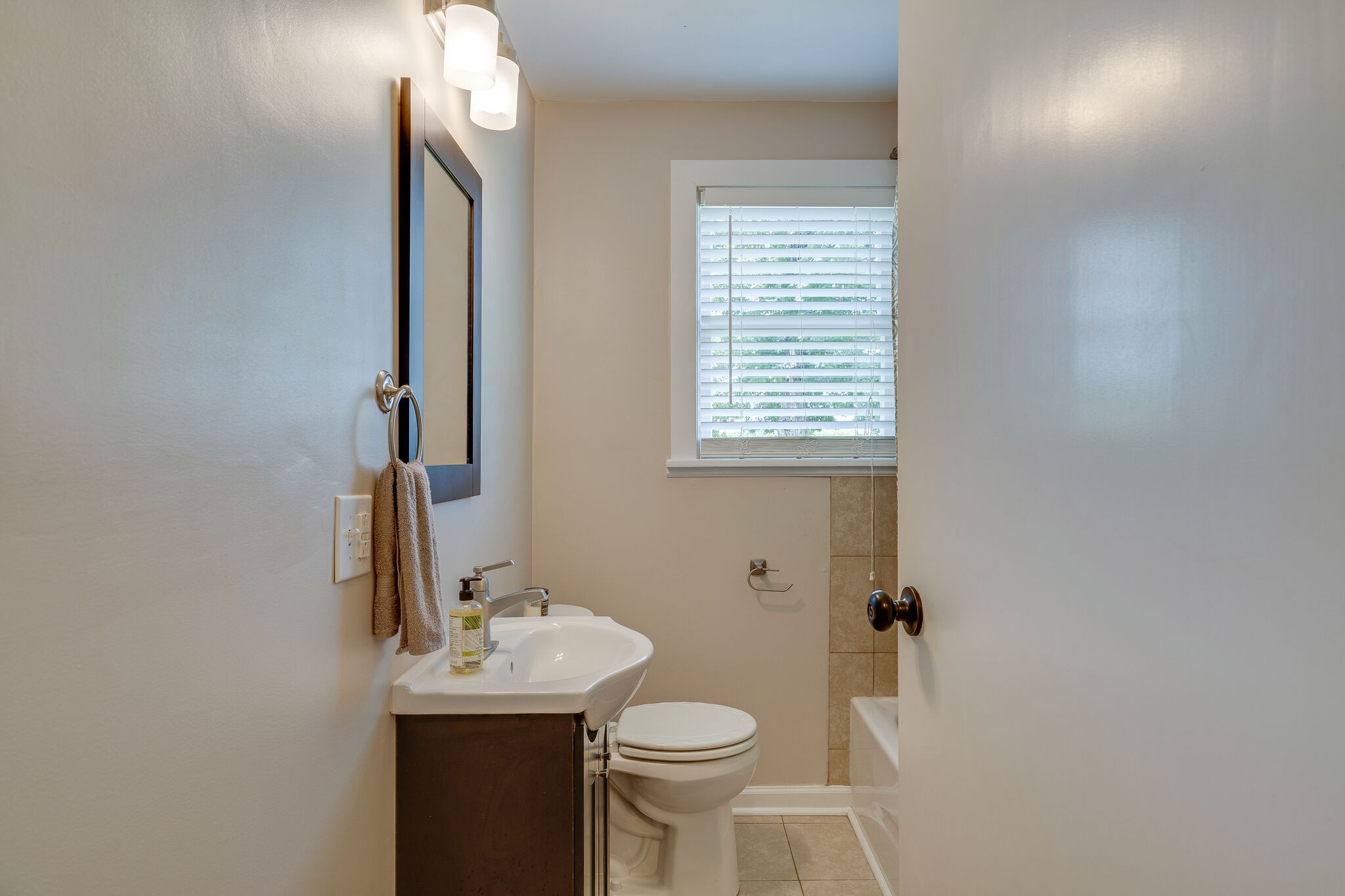 2241 Battle Creek Road Springfield, TN 37172 - Photo 22 of 32 a bathroom with a sink a toilet and mirror