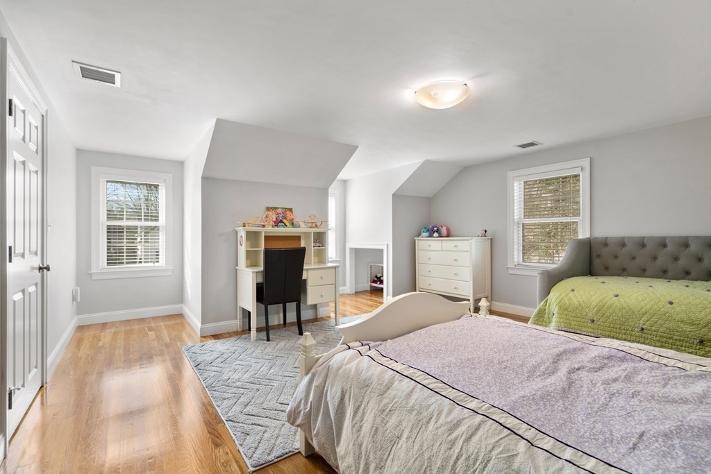 5 Wynnewood Road Wellesley, MA 02481 - Photo 28 of 41 a bedroom with a large bed and a couch