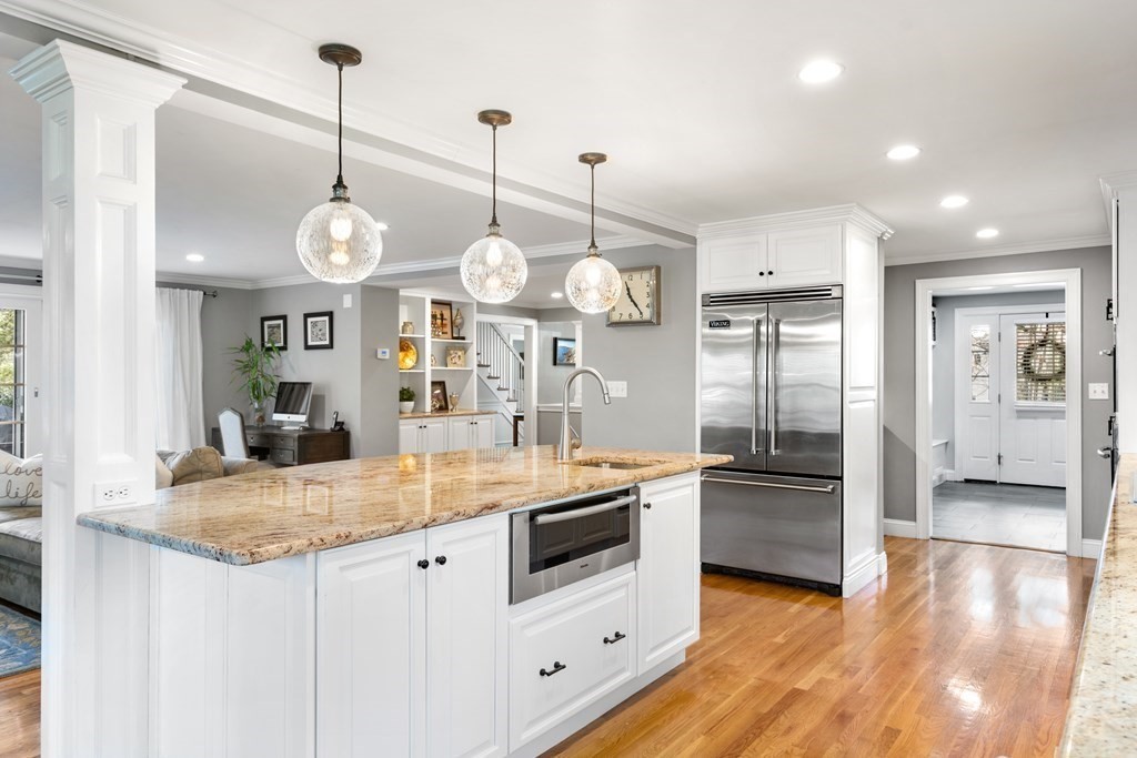 5 Wynnewood Road Wellesley, MA 02481 - Photo 8 of 41 a large kitchen with stainless steel appliances kitchen island granite countertop a stove a sink and a wooden floors