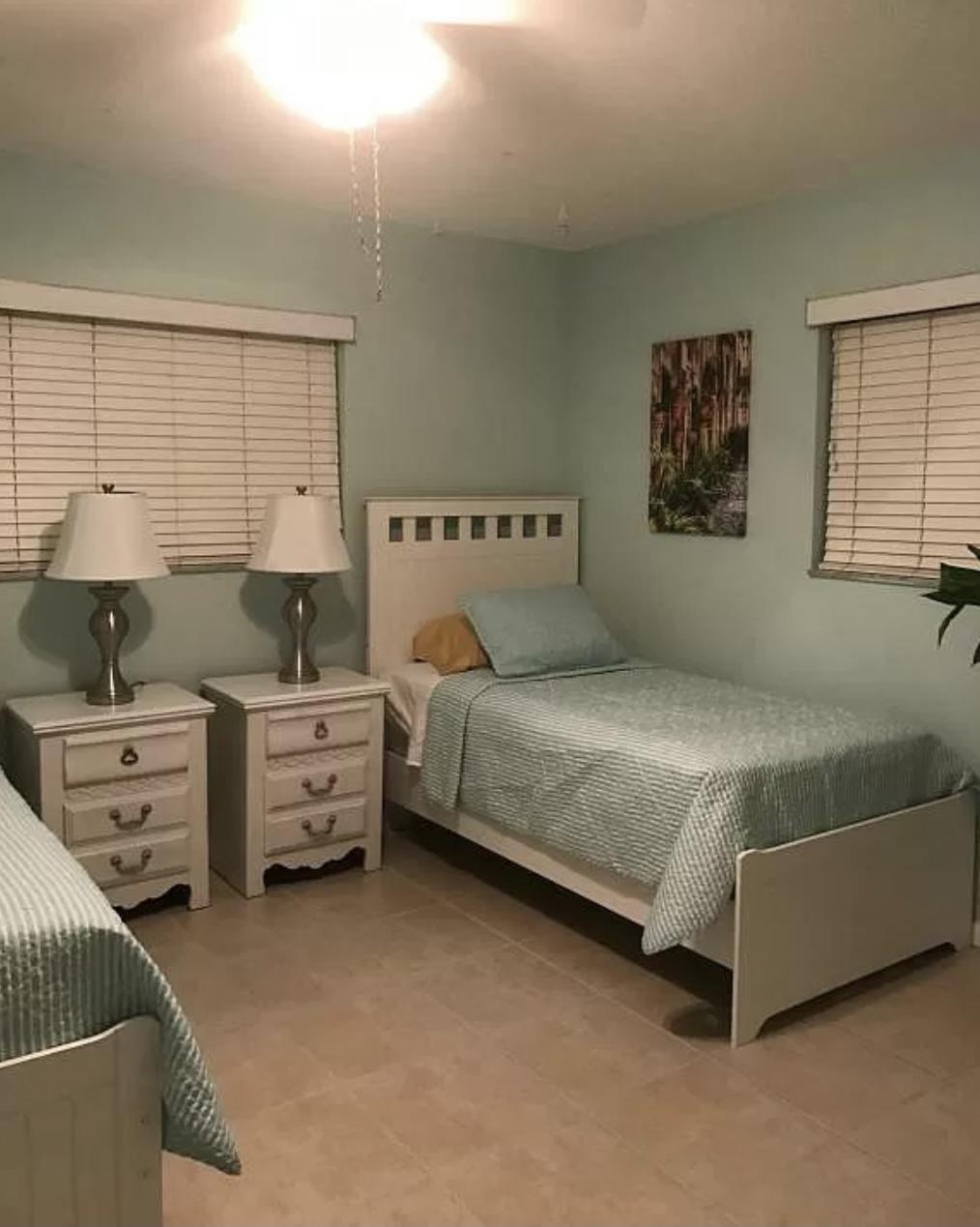 27 Pinehurst Lane Boca Raton, FL 33431 - Photo 7 of 12 a bedroom with a bed and window