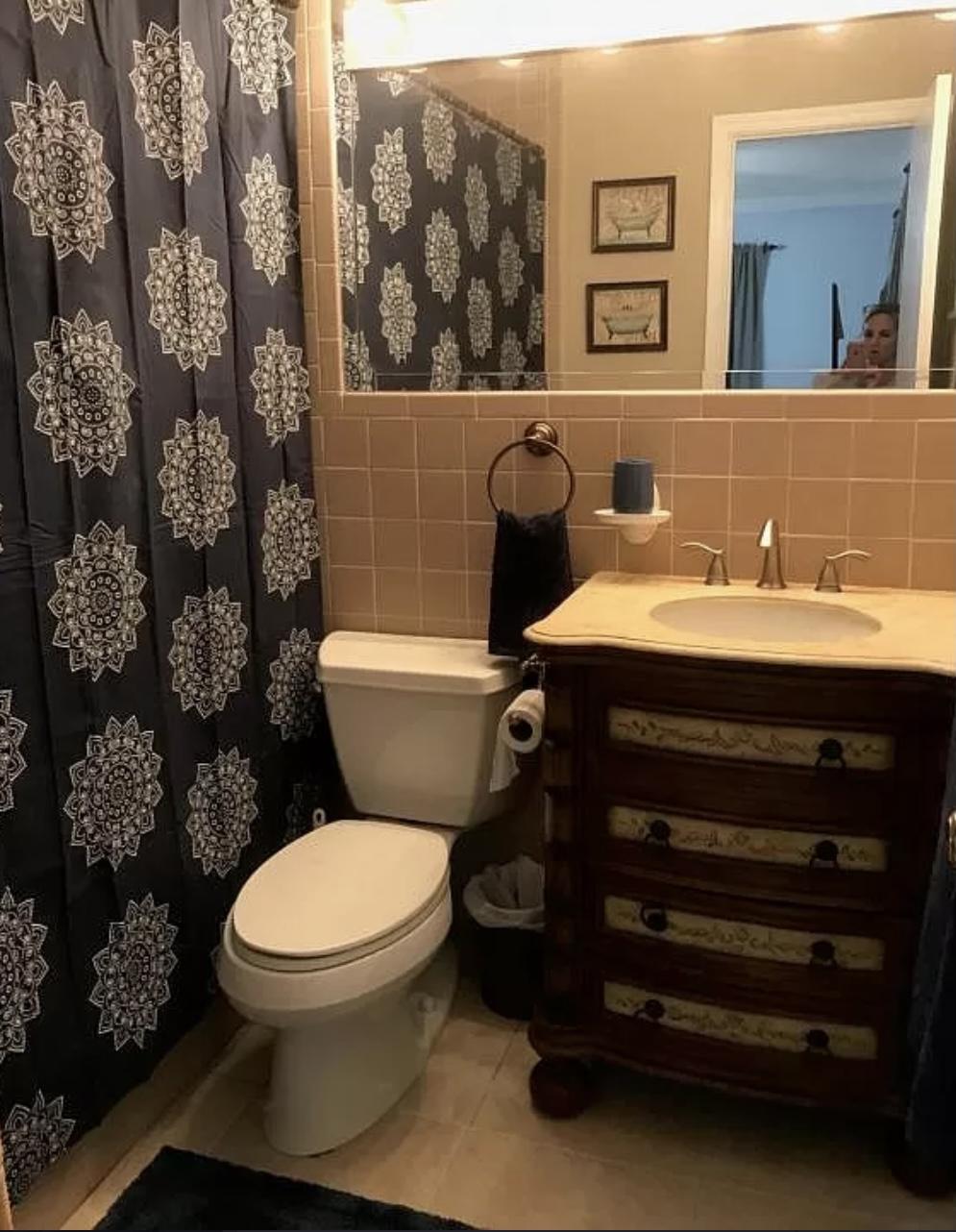 27 Pinehurst Lane Boca Raton, FL 33431 - Photo 8 of 12 a bathroom with a toilet sink and mirror