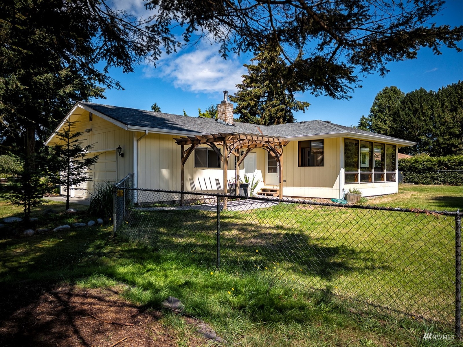 521 Cline Road Sequim, WA 98382 - Photo 3 of 30 a view of a house with backyard and a tree