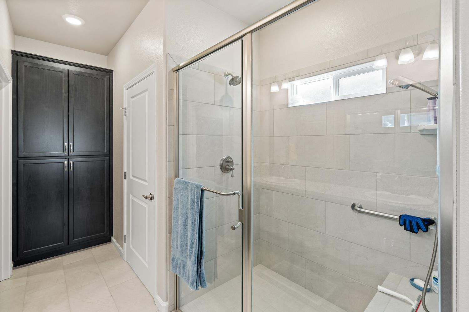 948 Hogan Road Galt, CA 95632 - Photo 12 of 20 a bathroom with a shower and a glass door