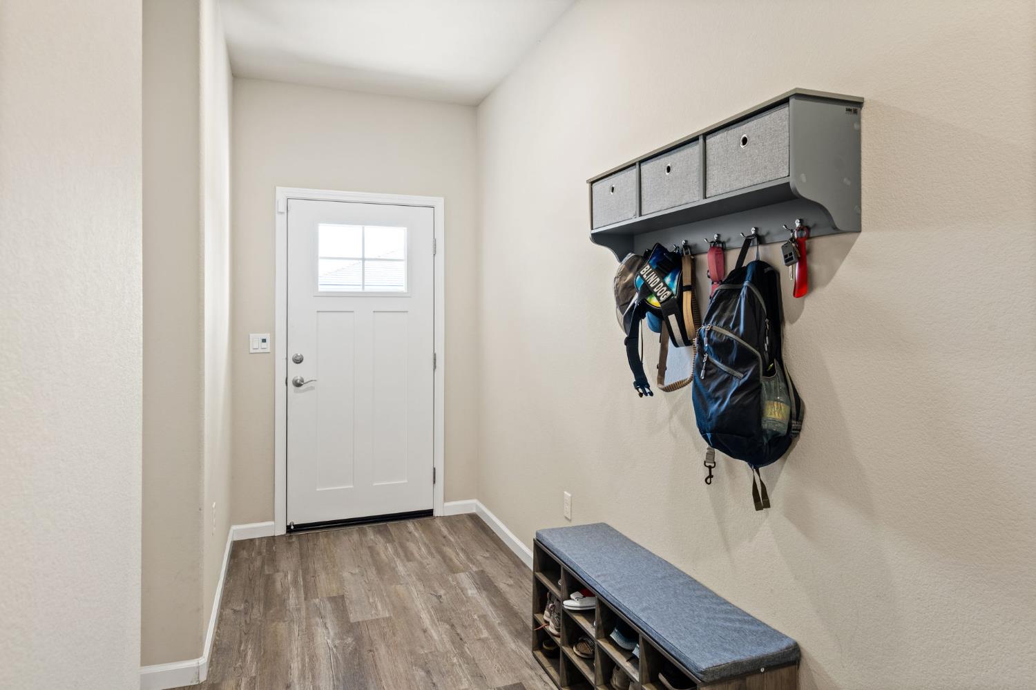 948 Hogan Road Galt, CA 95632 - Photo 3 of 20 a view of a hallway with wooden floor and door
