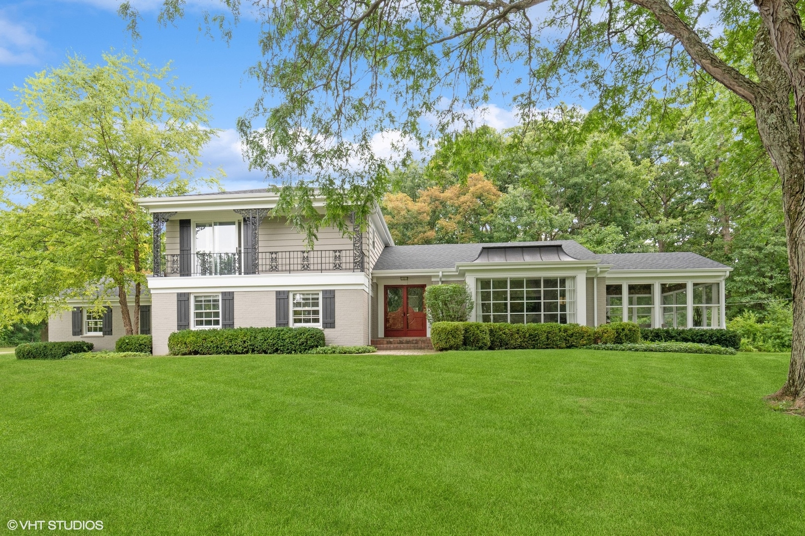 a front view of house with yard and green space