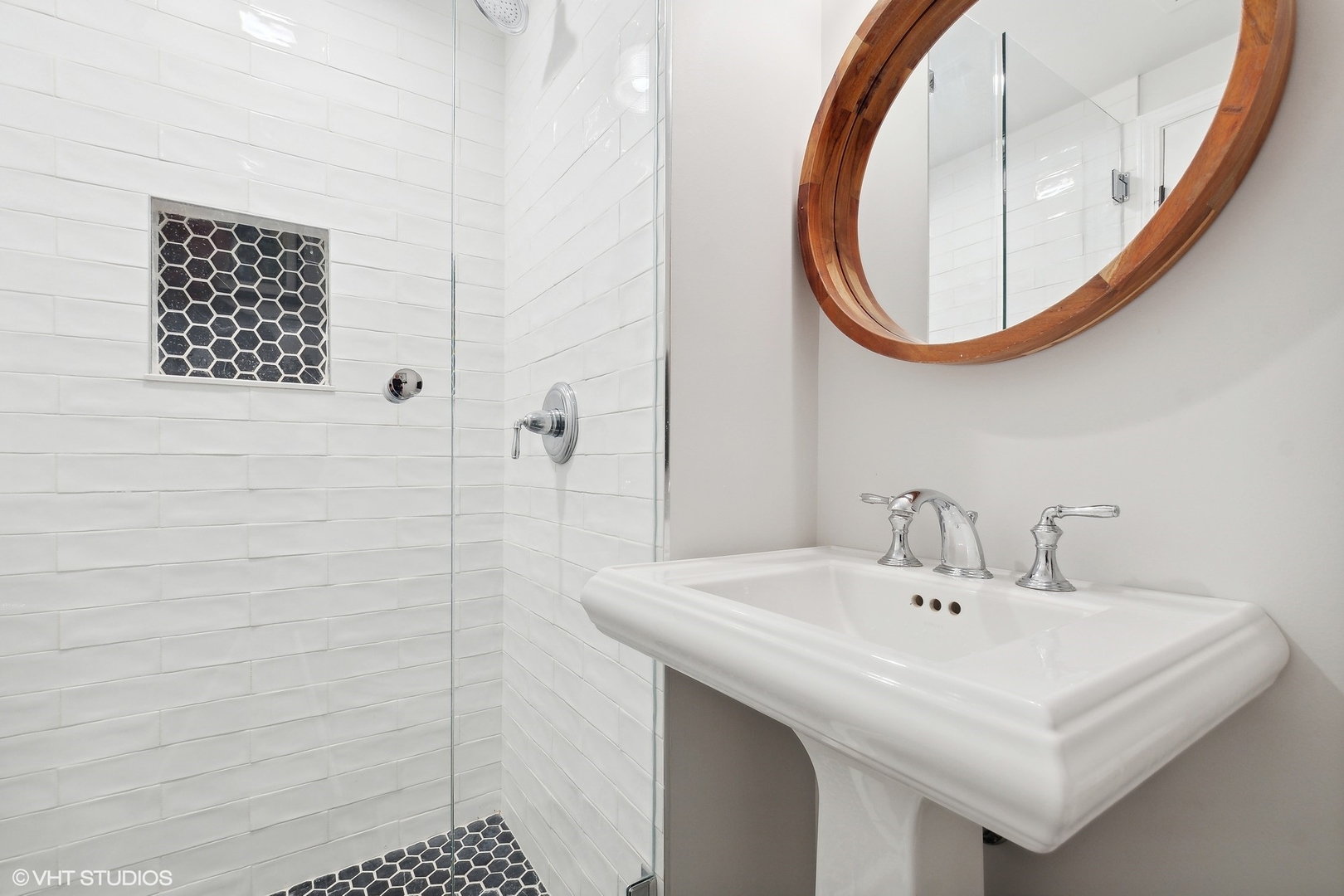 845 Forest Hill Road Lake Forest, IL 60045 - Photo 20 of 41 a bathroom with a sink a mirror and a shower