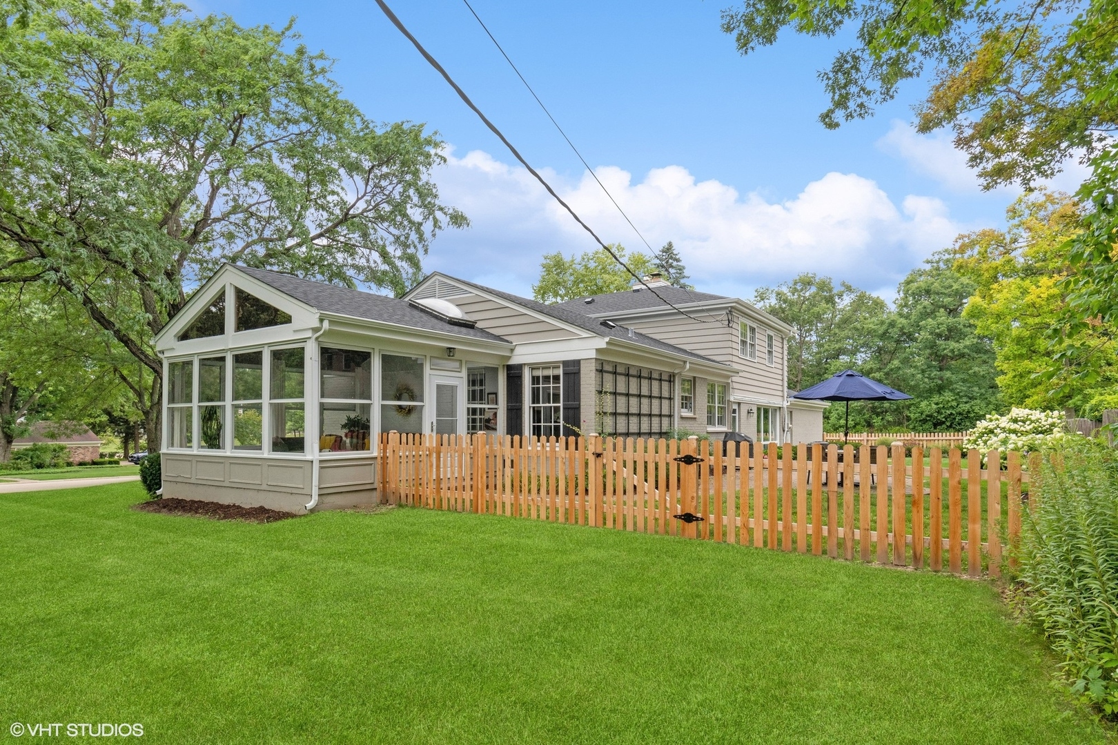845 Forest Hill Road Lake Forest, IL 60045 - Photo 32 of 41 a front view of a house with a garden