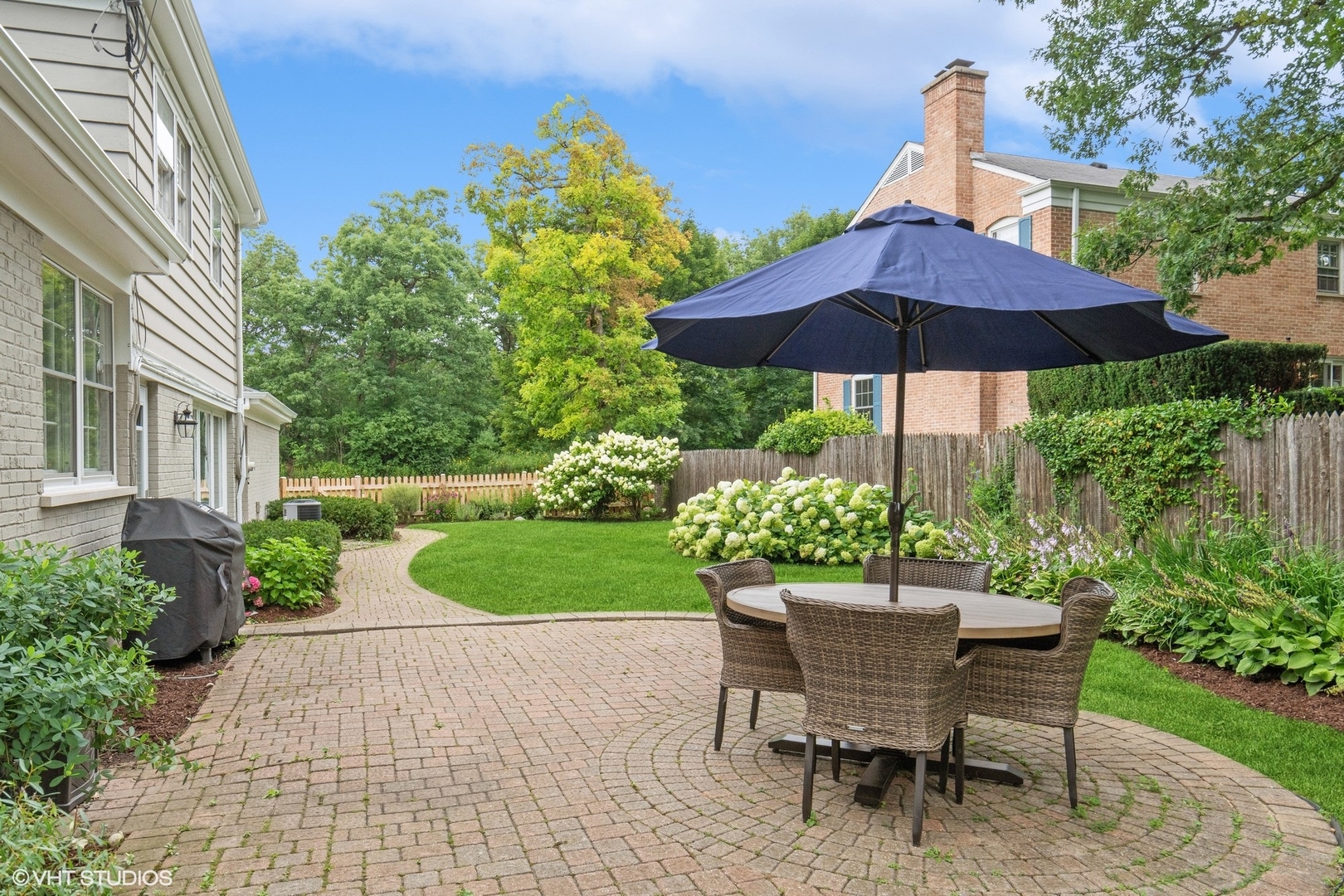 845 Forest Hill Road Lake Forest, IL 60045 - Photo 35 of 41 a view of a backyard with sitting area and furniture