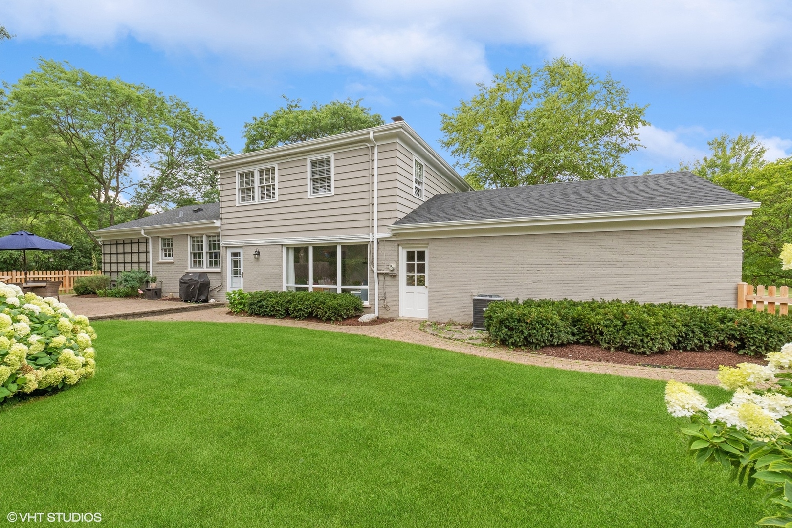 845 Forest Hill Road Lake Forest, IL 60045 - Photo 36 of 41 a front view of a house with a yard