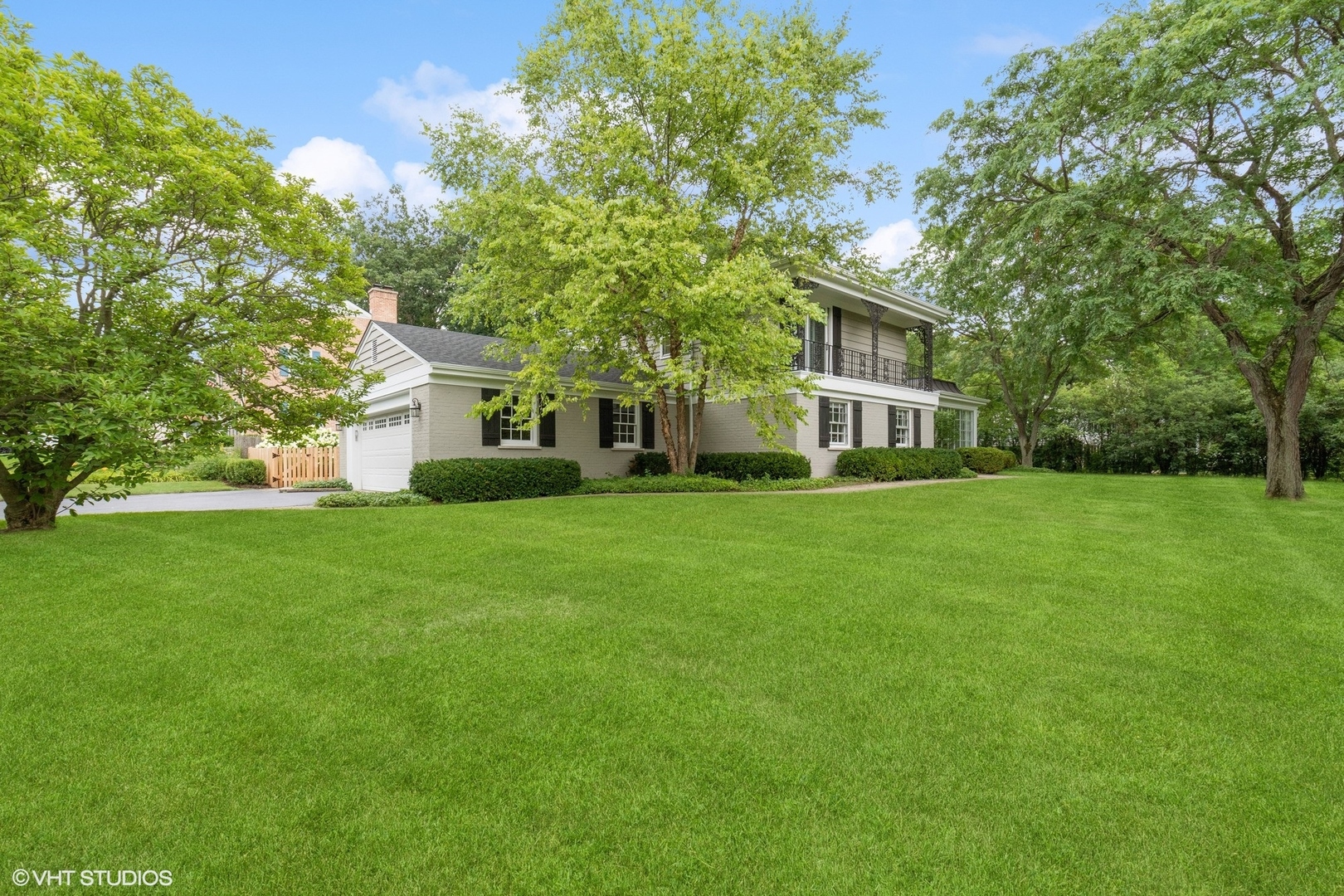 845 Forest Hill Road Lake Forest, IL 60045 - Photo 38 of 41 a front view of a house with a yard and trees
