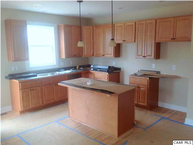 200 Harris Road Charlottesville, VA 22903 - Photo 5 of 15 a kitchen with stainless steel appliances granite countertop a sink stove and refrigerator