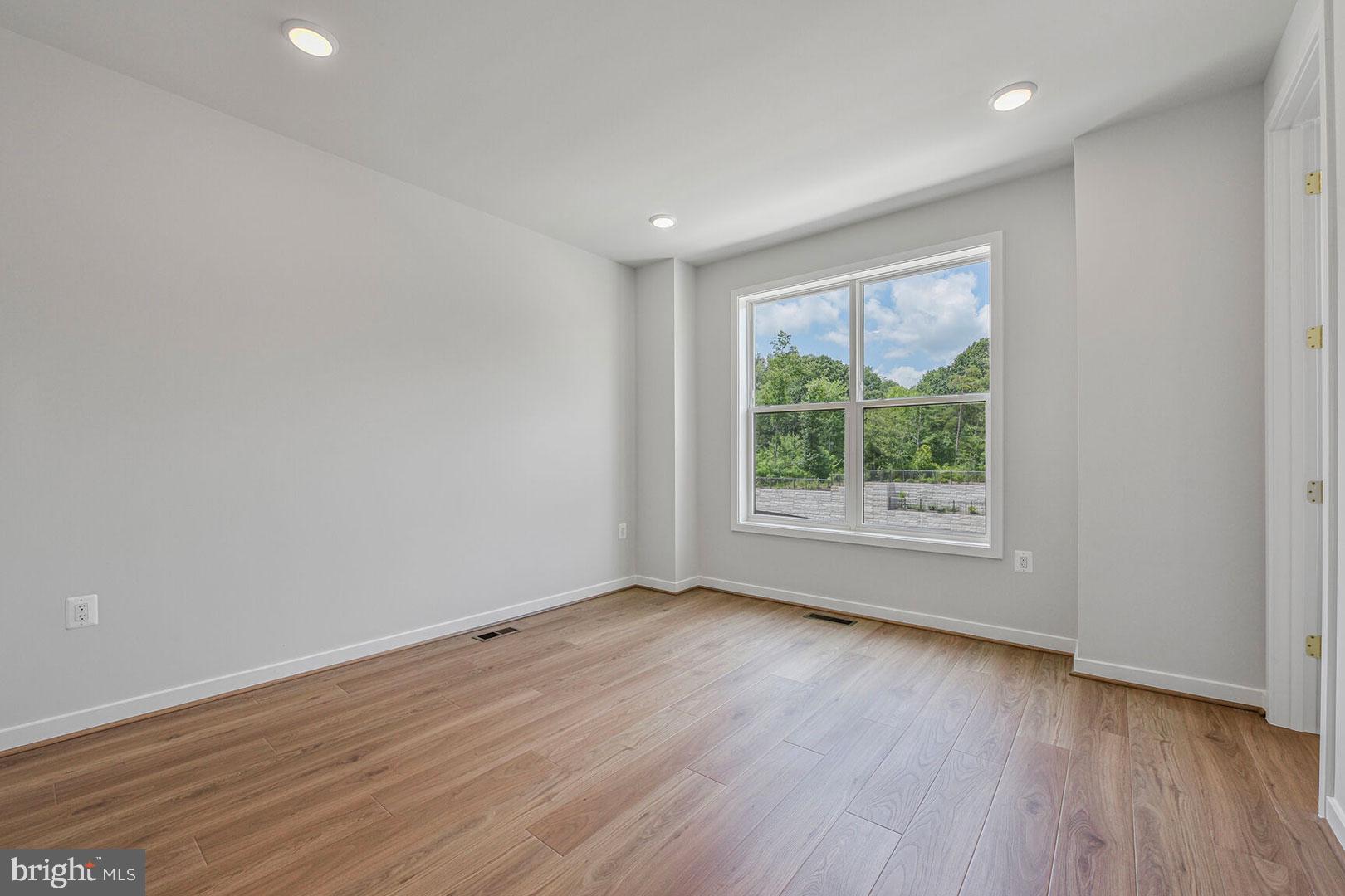 1624 Fellowship Square Reston, VA 20190 - Photo 15 of 18 a view of an empty room with wooden floor and a window