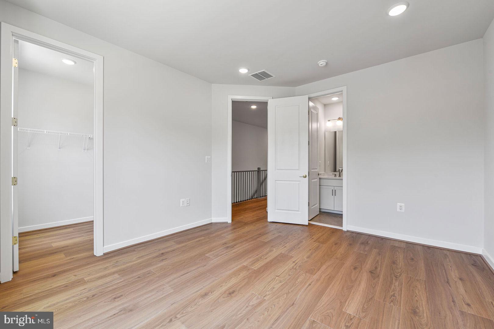 1624 Fellowship Square Reston, VA 20190 - Photo 16 of 18 a view of an empty room with wooden floor and a window