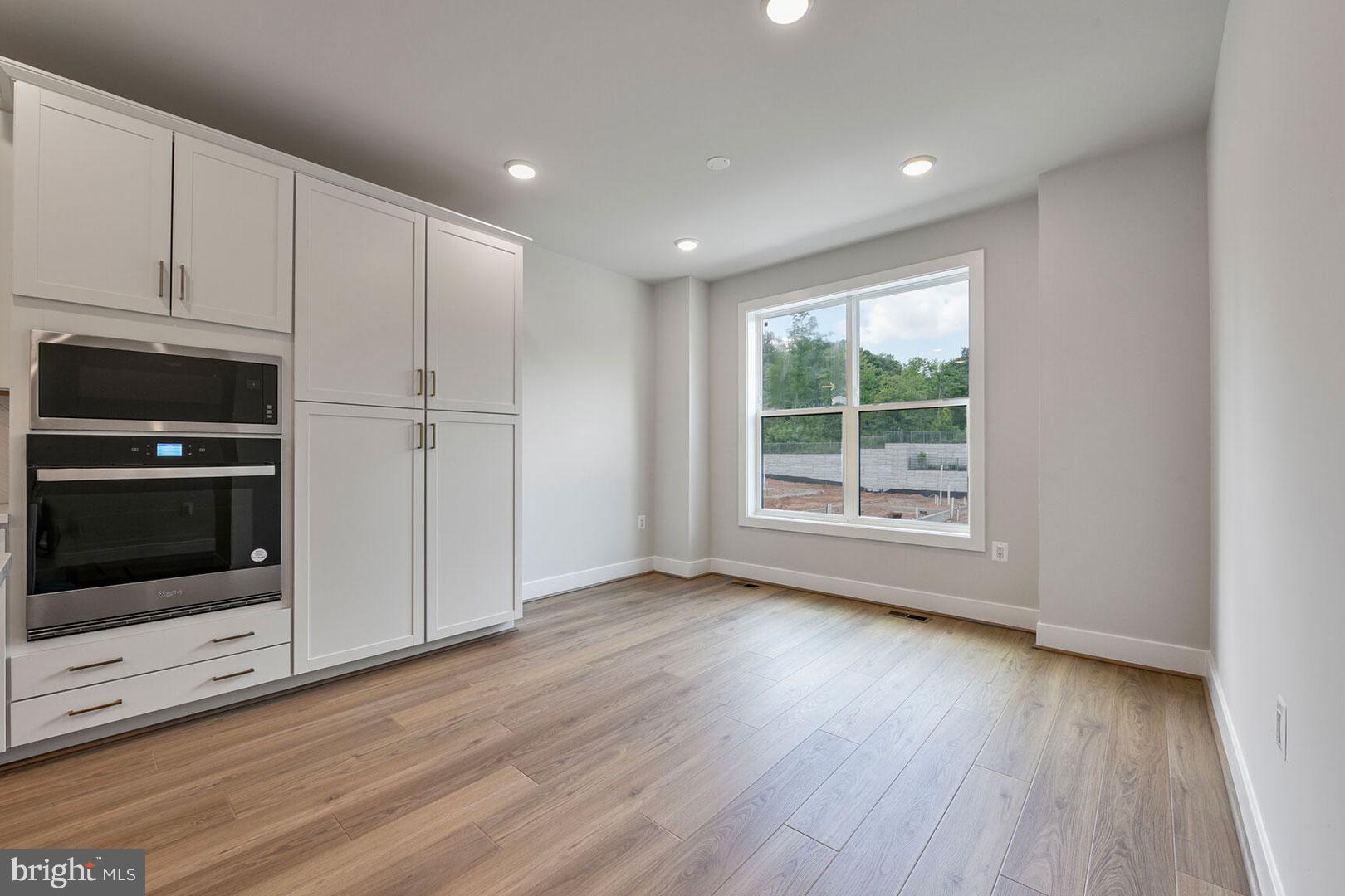 1624 Fellowship Square Reston, VA 20190 - Photo 7 of 18 a view of an empty room with wooden floor and a window