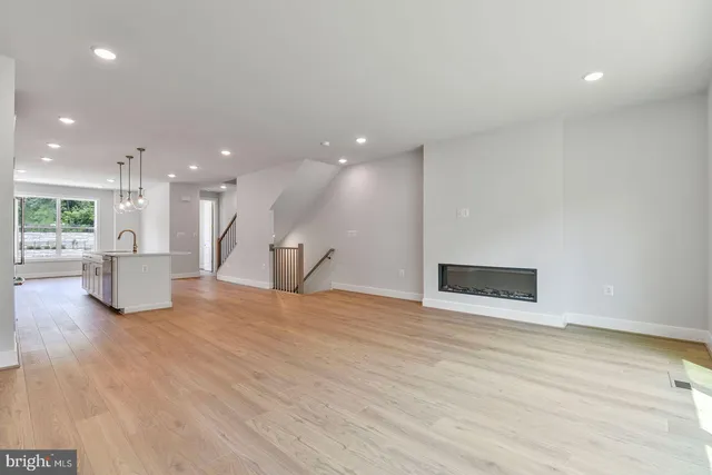 a view of a kitchen with a sink and a stove
