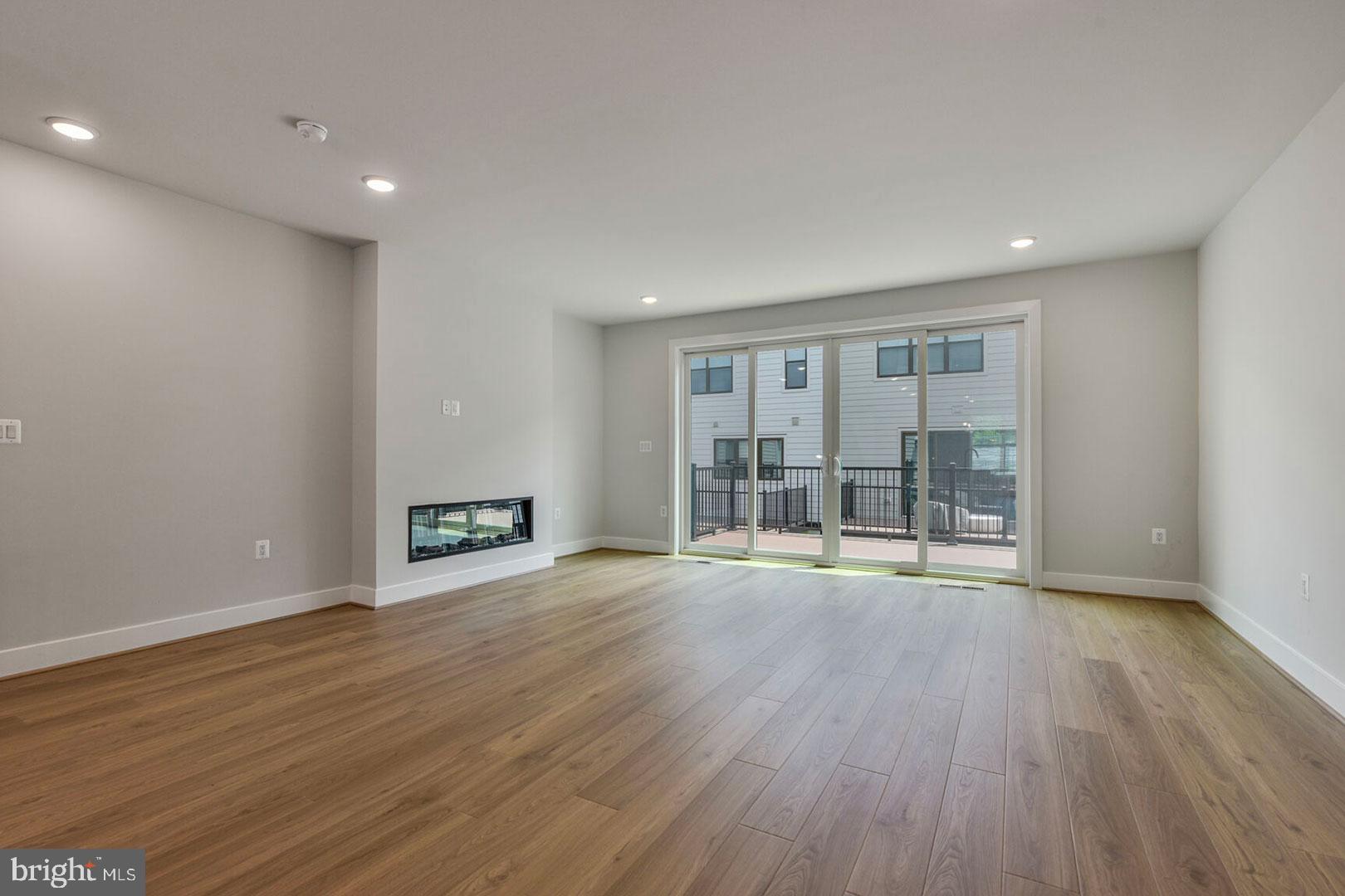 1624 Fellowship Square Reston, VA 20190 - Photo 10 of 18 a view of an empty room with wooden floor and a window