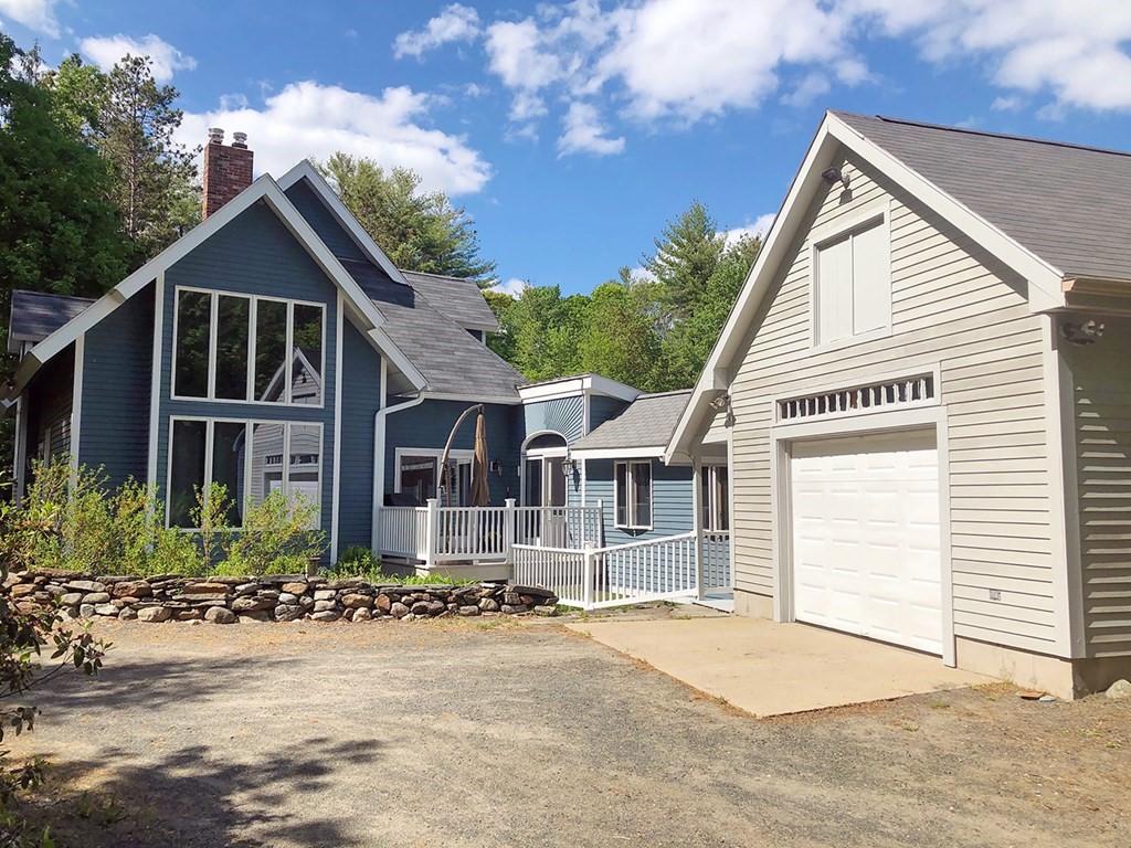 2 Old Waite Road Petersham, MA 01366 - Photo 4 of 42 a front view of a house with a yard and garage