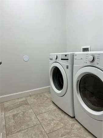 a room with gym equipment and a flat screen tv