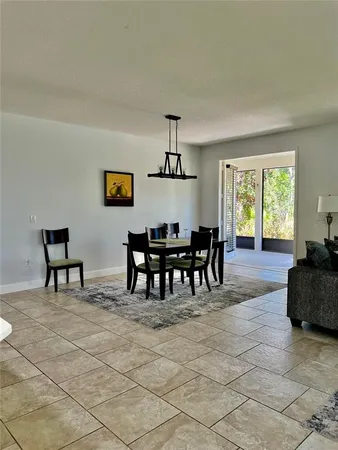 a view of a dining room with furniture and window