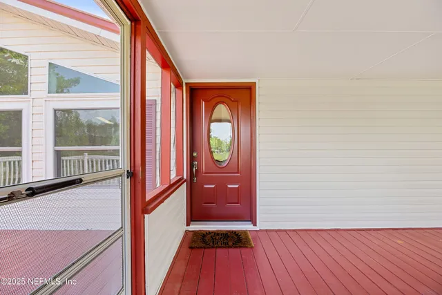 a view of a livingroom with furniture and a window