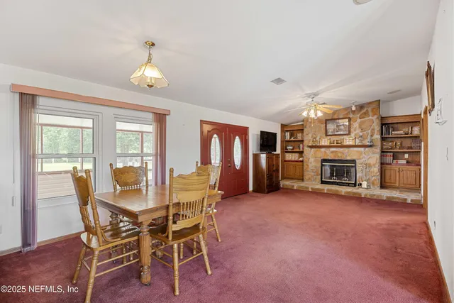 a view of a livingroom with furniture and a window