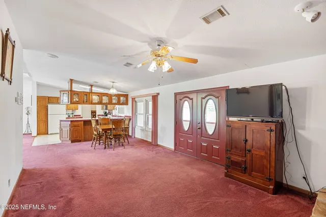a bathroom with a sink mirror and vanity