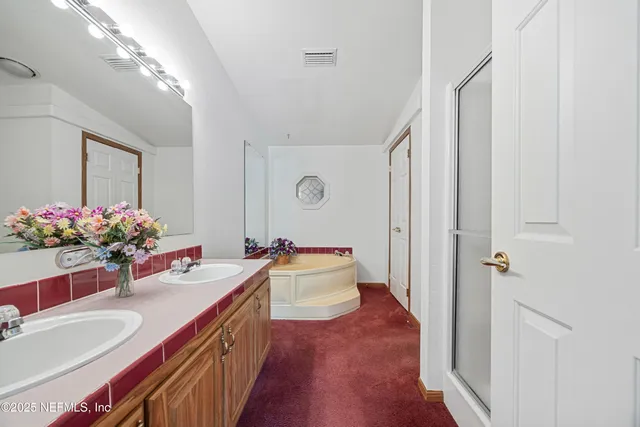 a view of empty room with wooden floor and fireplace