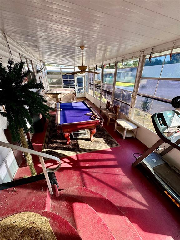 135 Oak Street Edgewater, FL 32141 - Photo 14 of 19 a room with lots of wooden chairs