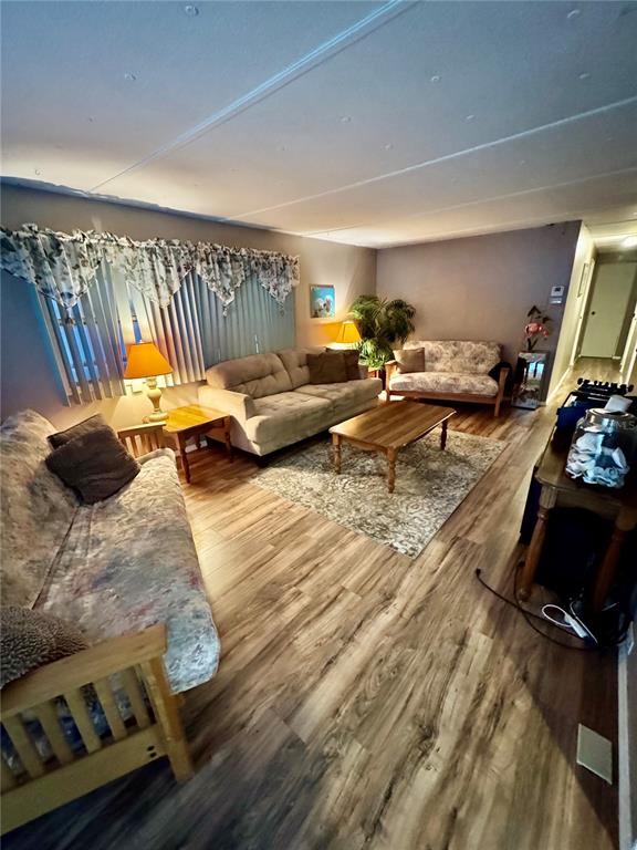 135 Oak Street Edgewater, FL 32141 - Photo 6 of 19 a bedroom with furniture and a flat screen tv