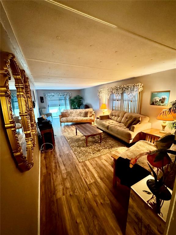 135 Oak Street Edgewater, FL 32141 - Photo 7 of 19 a living room with furniture and a flat screen tv