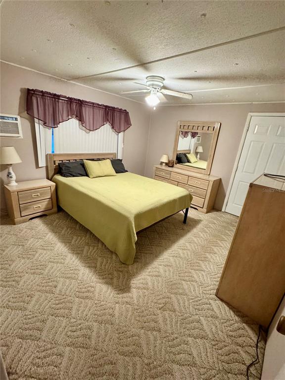 135 Oak Street Edgewater, FL 32141 - Photo 8 of 19 a spacious bedroom with a bed and window