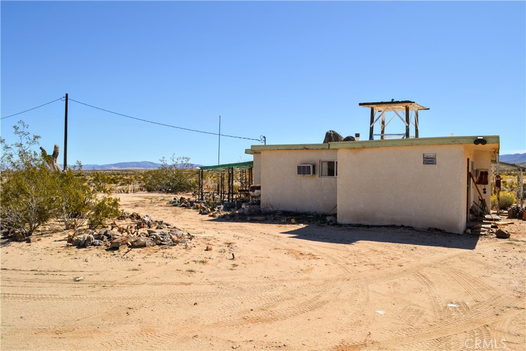4040 Peter Rabbit Trail Twentynine Palms, CA 92277 - Photo 23 of 28 a view of a house with snow in the background