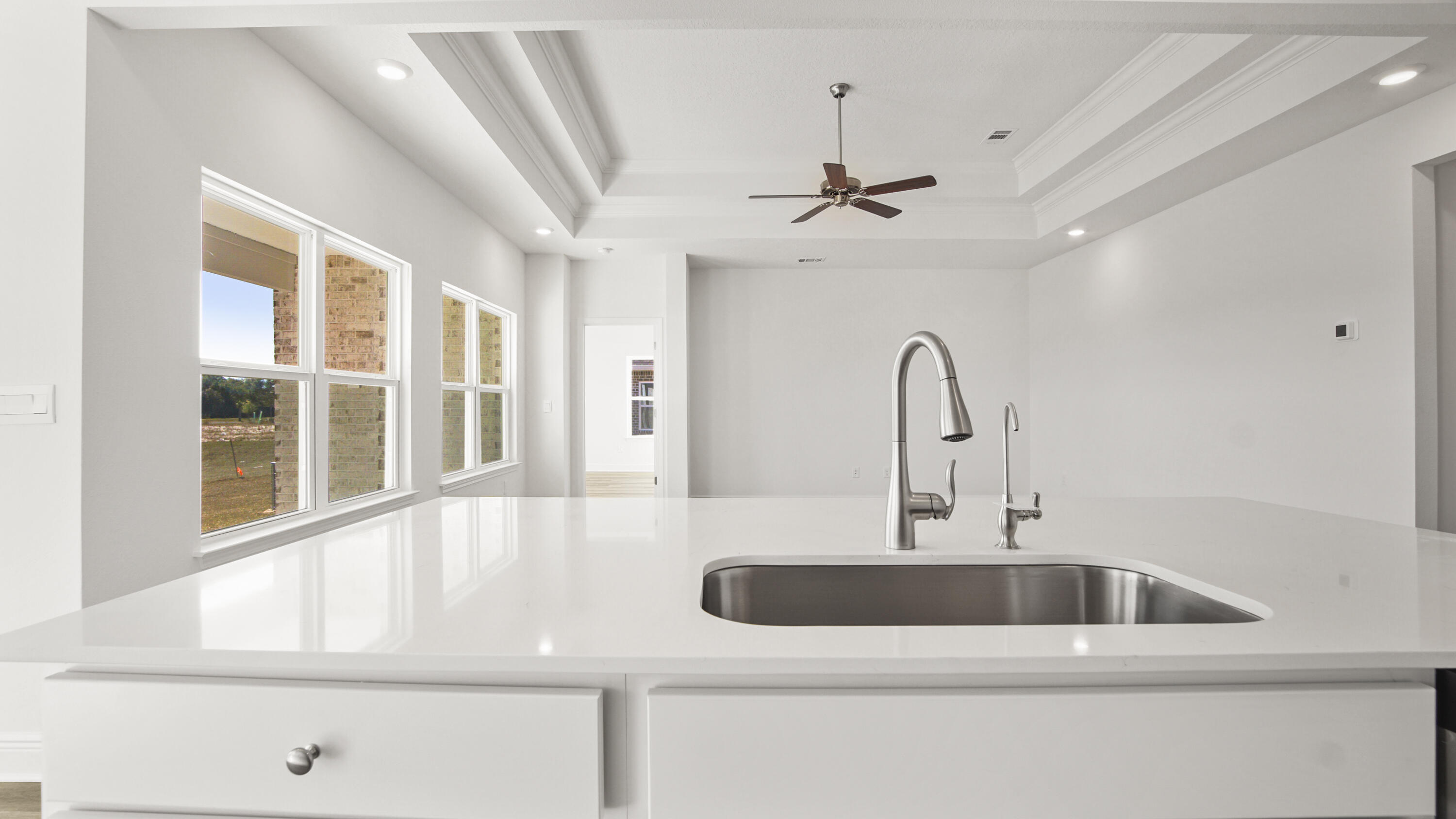 13 West W Farm Freeport, FL 32439 - Photo 21 of 38 a kitchen with a sink and chandelier