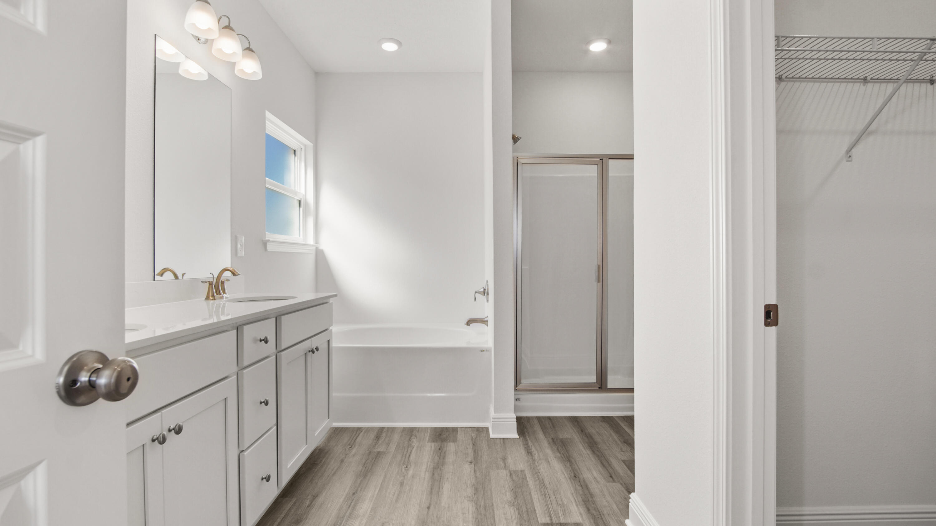 13 West W Farm Freeport, FL 32439 - Photo 28 of 38 a bathroom with a sink a large mirror and shower