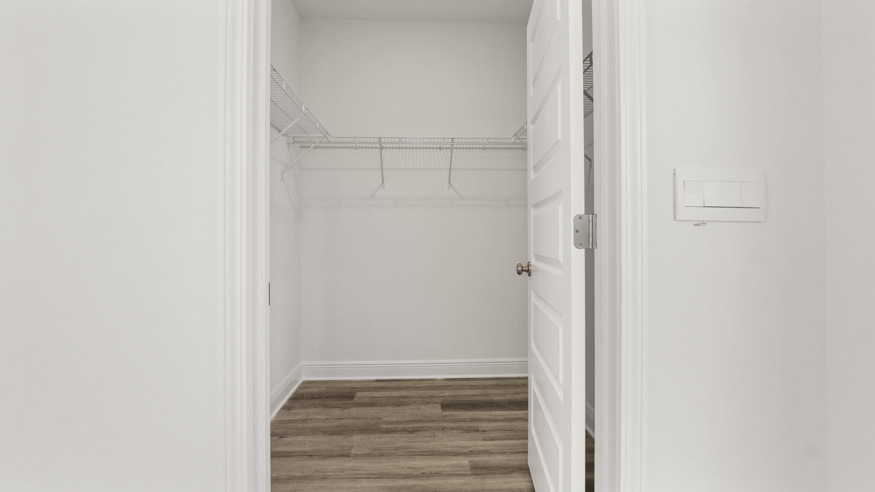 13 West W Farm Freeport, FL 32439 - Photo 29 of 38 a view of an empty walk in closet with empty racks