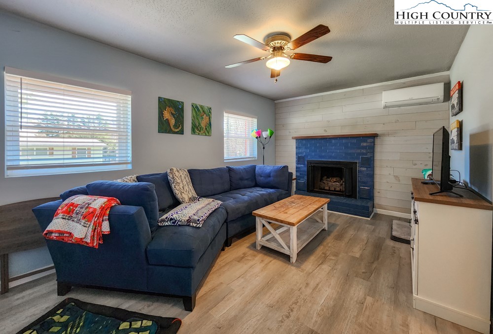 130 Chandy Street Boone, NC 28607 - Photo 12 of 21 a living room with furniture fireplace and a flat screen tv