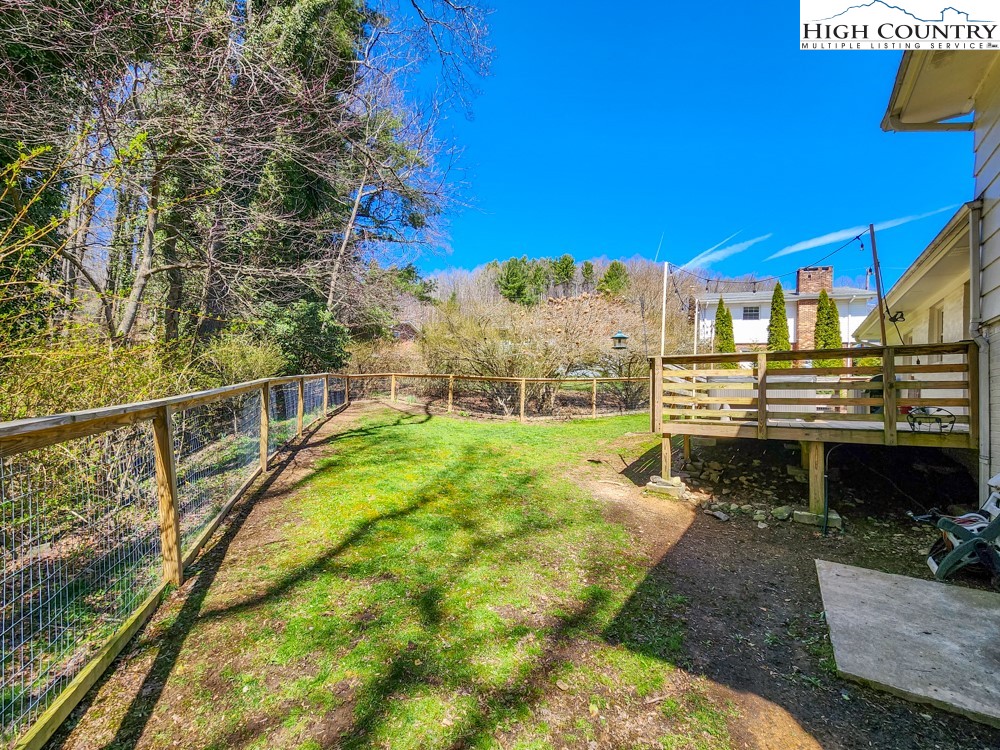 130 Chandy Street Boone, NC 28607 - Photo 17 of 21 a view of a swimming pool with a table and chairs