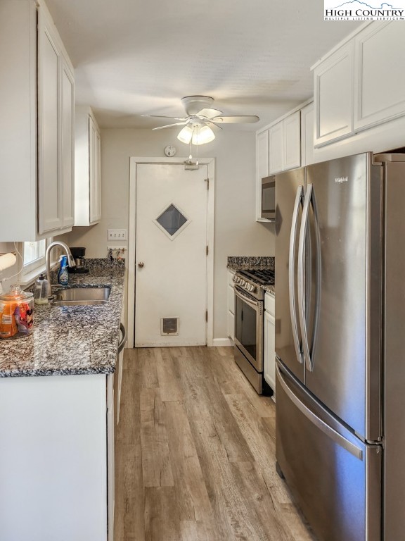 130 Chandy Street Boone, NC 28607 - Photo 6 of 21 a kitchen with stainless steel appliances granite countertop a refrigerator and a sink
