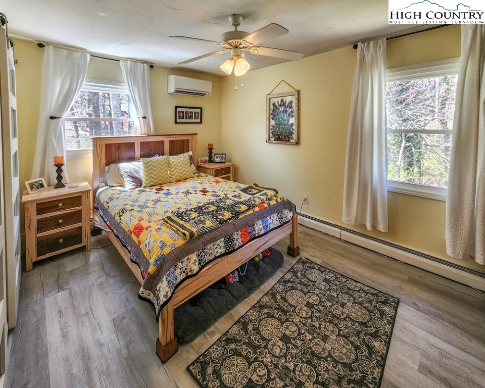 130 Chandy Street Boone, NC 28607 - Photo 8 of 21 a bedroom with a bed and a window