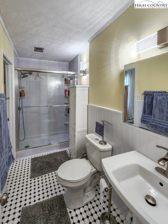 130 Chandy Street Boone, NC 28607 - Photo 9 of 21 a bathroom with a sink toilet a mirror and shower