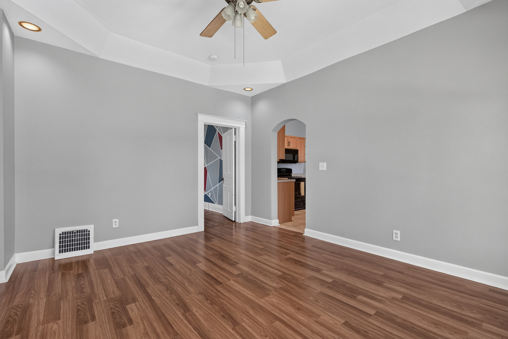1128 Butler Street Morris, IL 60450 - Photo 11 of 28 a view of an empty room with a window and wooden floor