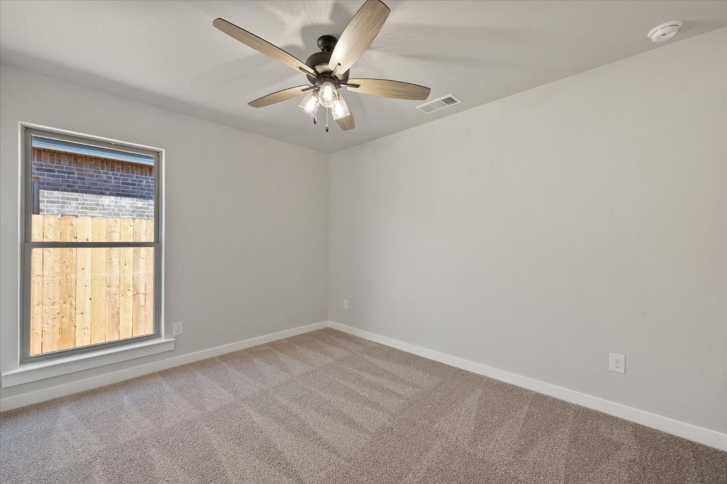 7429 30th Street Lubbock, TX 79407 - Photo 17 of 20 an empty room with a window