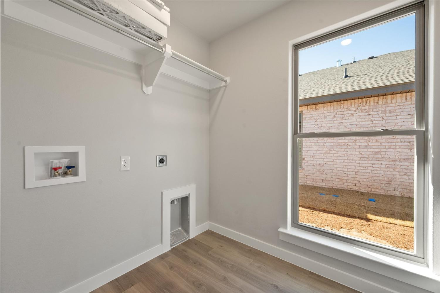 7429 30th Street Lubbock, TX 79407 - Photo 19 of 20 a view of a small space with wooden floor and a window